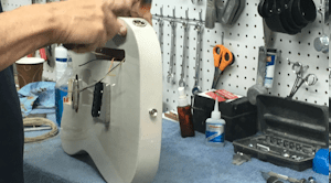 Man assembling an electric guitar
